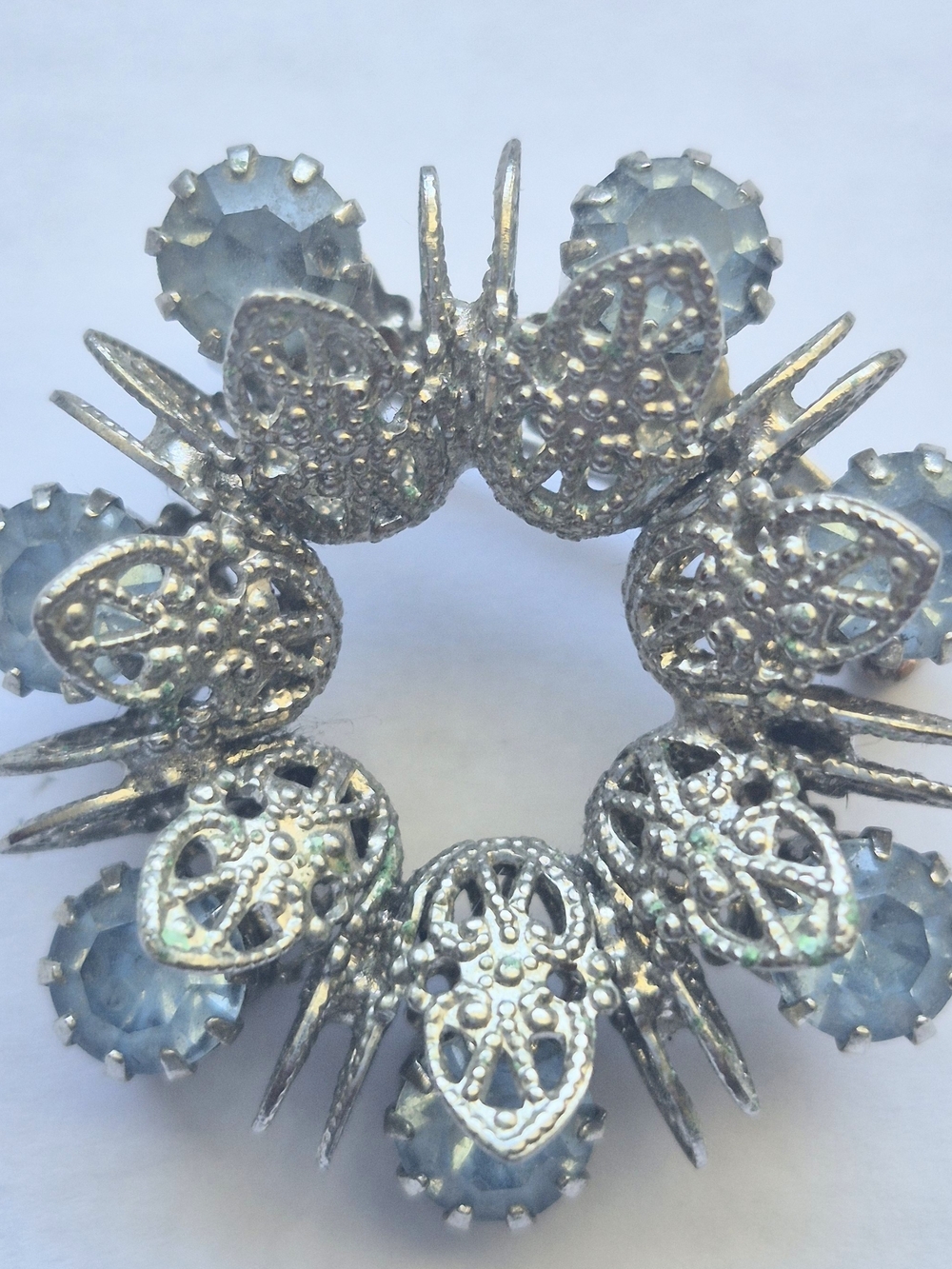 Vintage silver-tone filigree circle wreath brooch